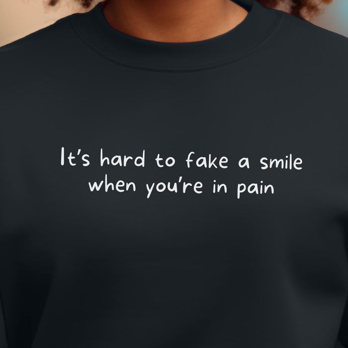 It's hard to fake a smile when you're in pain - Unisex Crewneck Sweatshirt